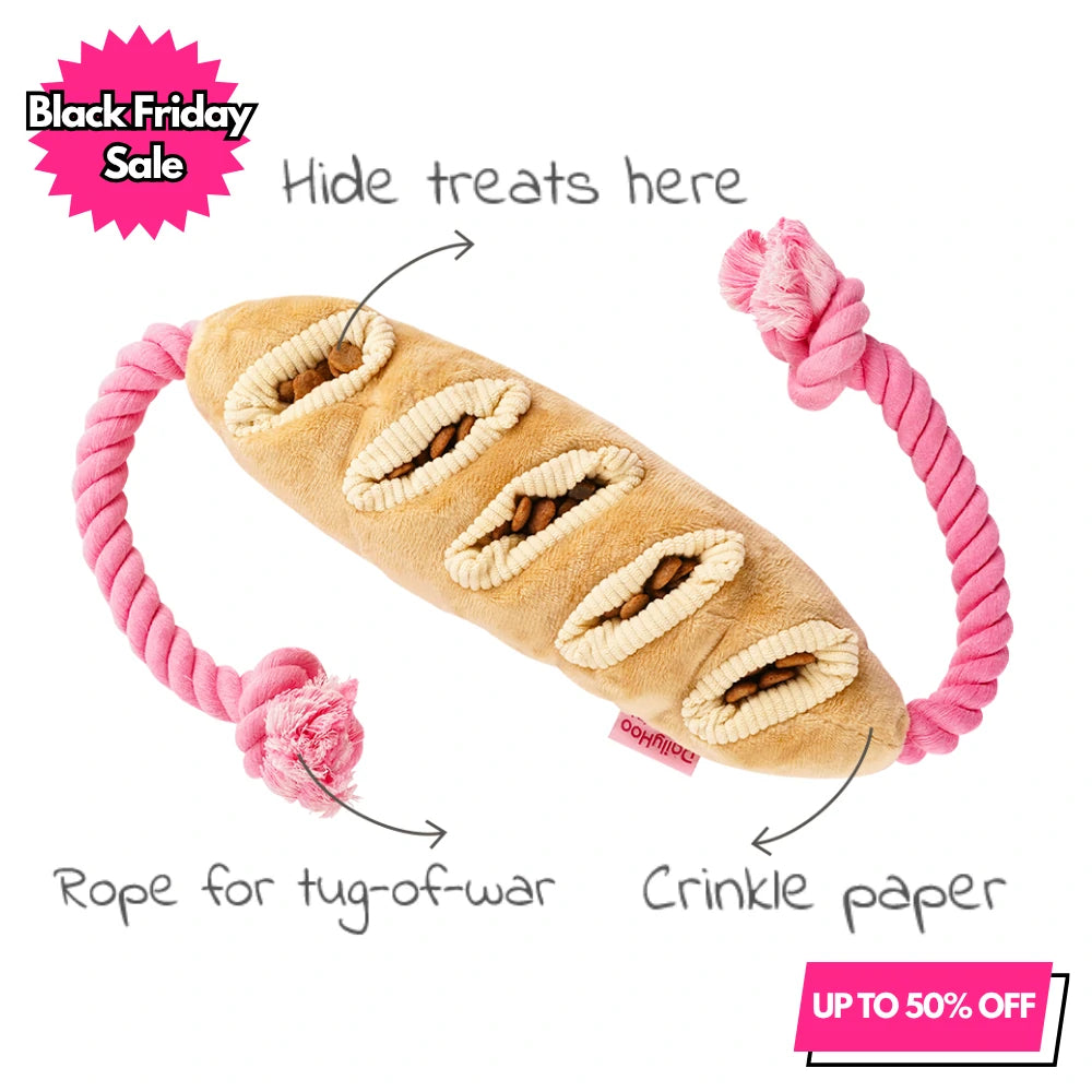 Plush baguette dog toy with a pink rope for tug-of-war and open pockets for treat-hiding nosework. The toy includes crinkle paper and is marked with "Black Friday Sale" and "UP TO 50% OFF" promotional text.